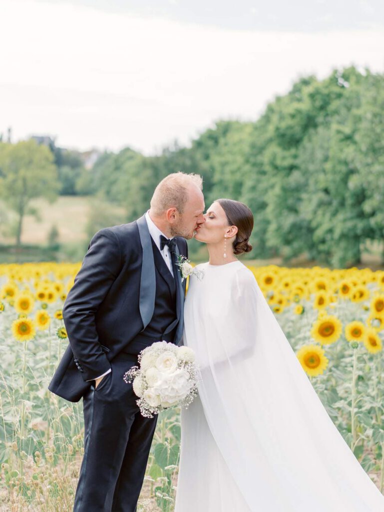 Bride and groom in a sunflower field
