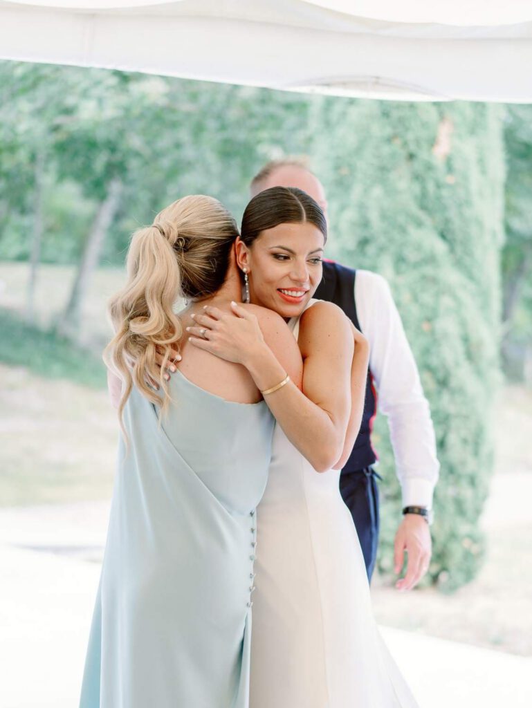 Bride hugging her sister