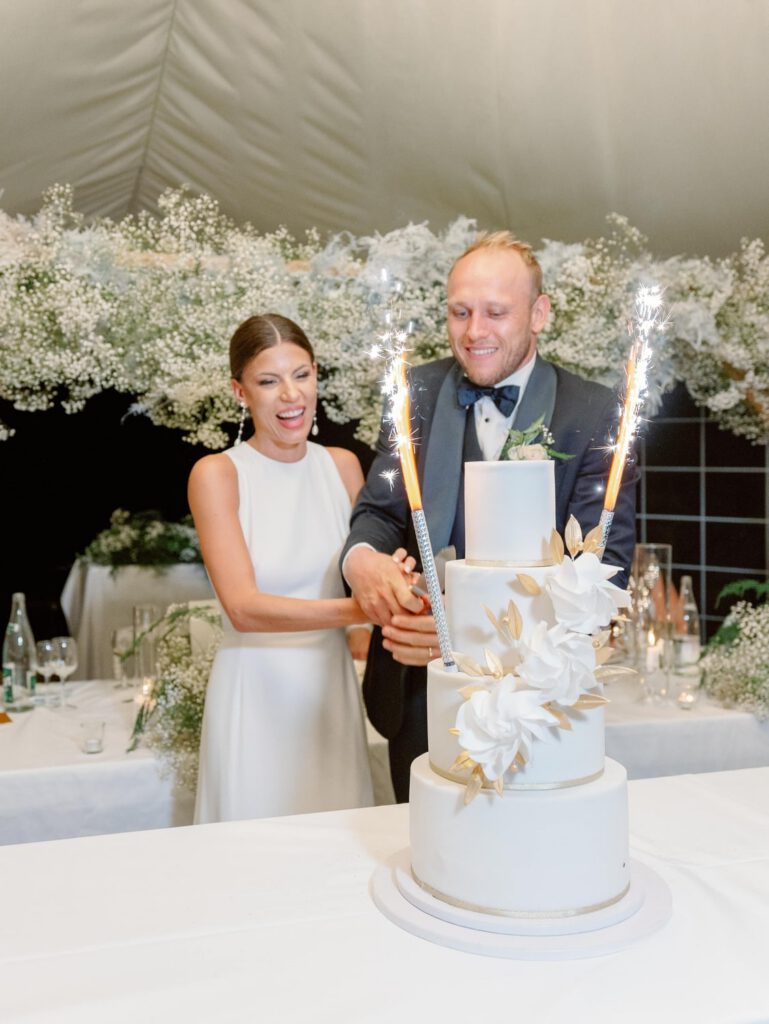 Bride and groom cutting the cake