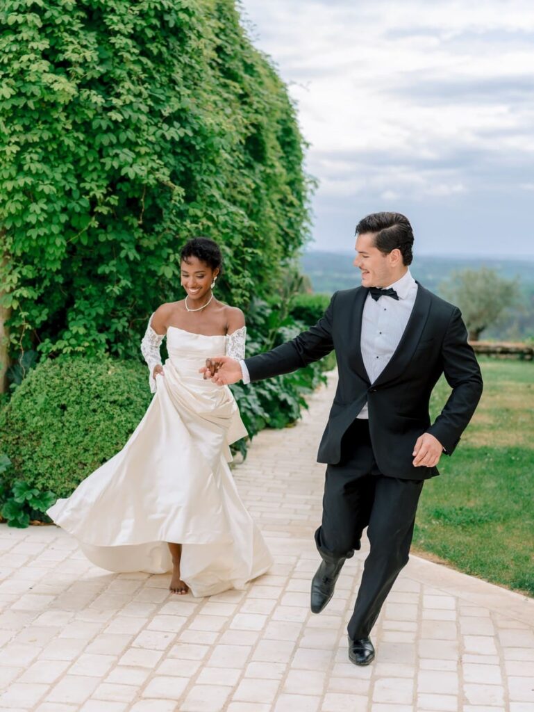 bride and groom running