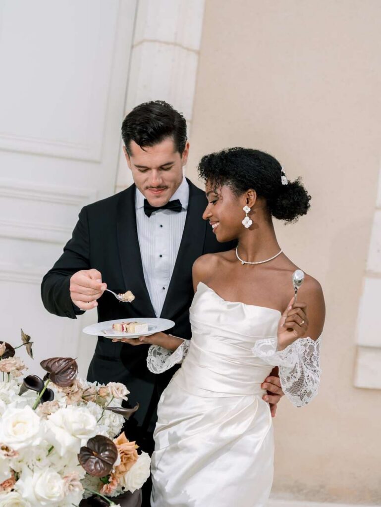 bride and groom eating cake