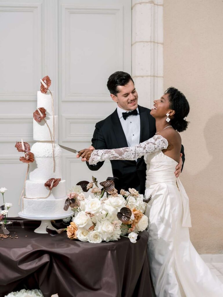 Bride and groom cutting the cake