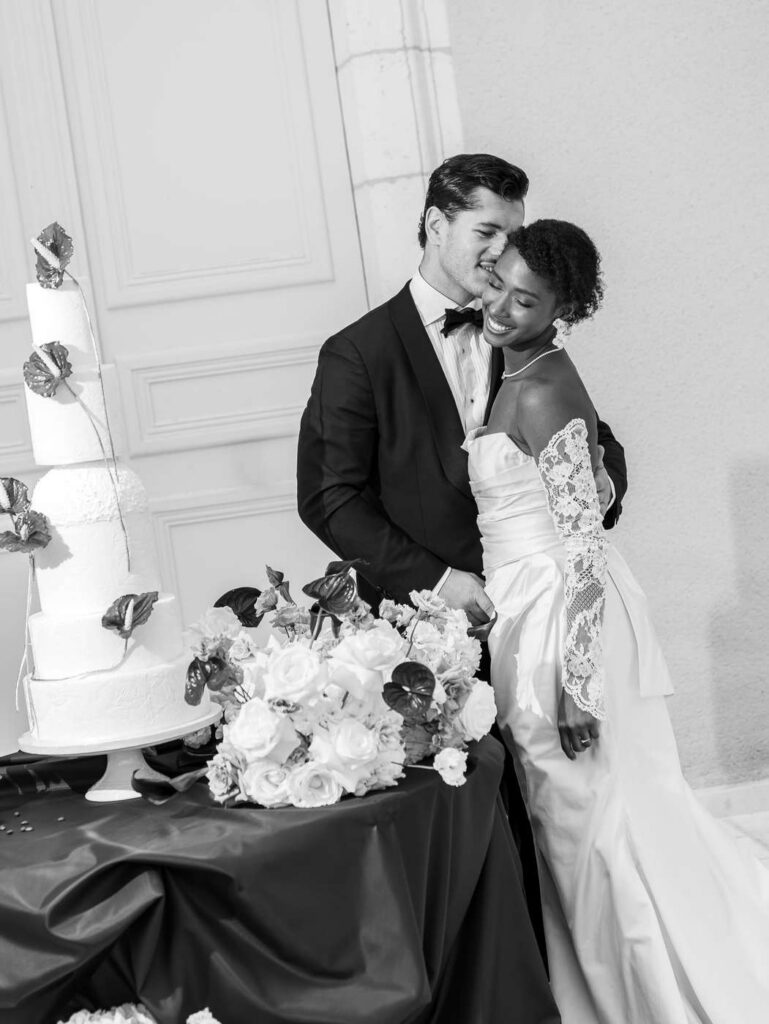 Bride and groom around the cake at Chateau de Bagatelle in Dordogne