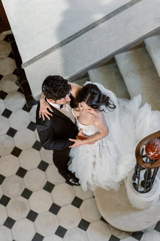 bride and groom in a staircase