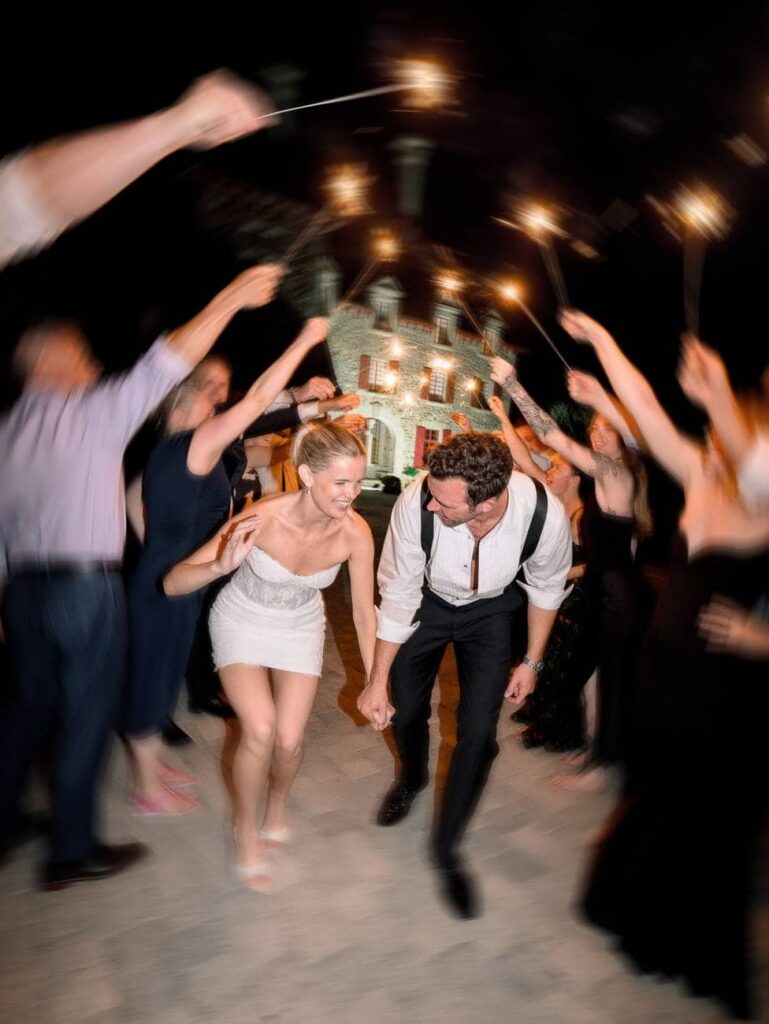 bride and groom between sparklers