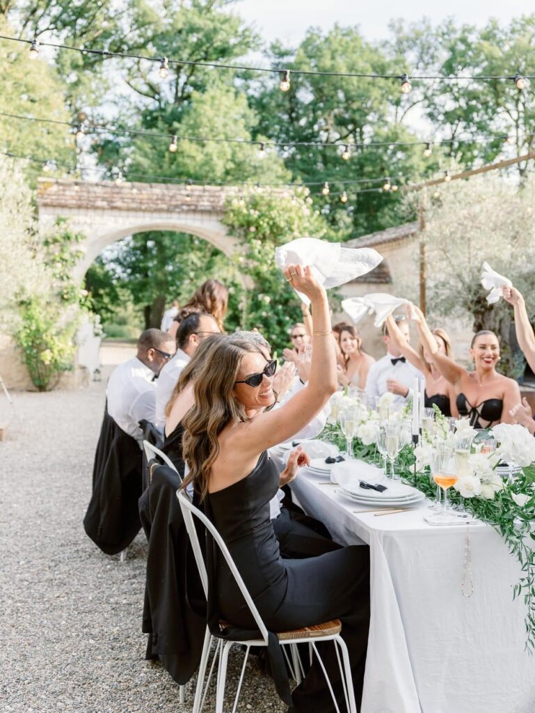 guests welcoming bride and groom during dinner